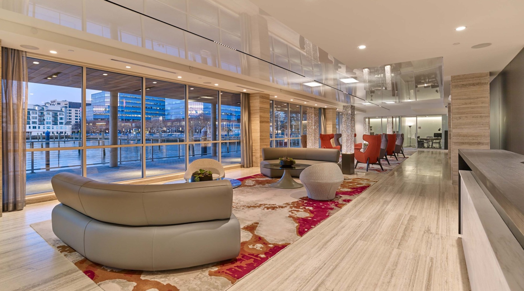 a spacious waterfront room with lounge seating