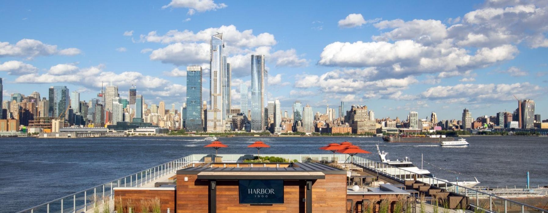 a building next to a body of water with boats in it