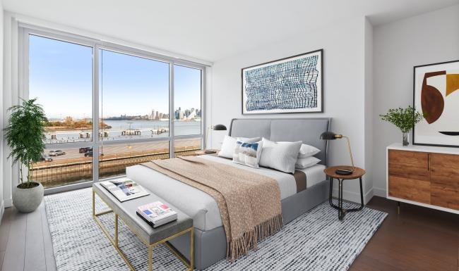 a bedroom with a large window