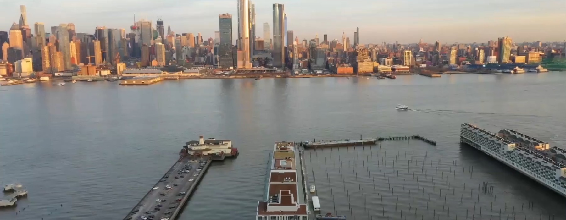 a body of water and a skyline with skyscrapers